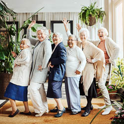 group of older adult women line dancing
